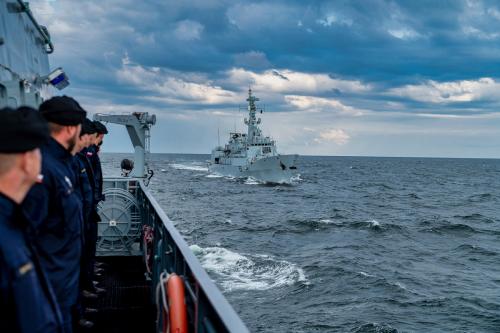 ORP Kormoran with a Pakistani frigate